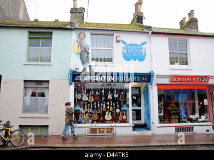 Brighton Guitars store in North Laine area of Brighton with a Jimi Hendrix mural on the wall Stock Photo