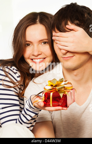 https://l450v.alamy.com/450v/d44w3m/attractive-happy-woman-with-big-toothy-smile-holding-husband-eyes-d44w3m.jpg