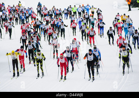 Partcipants race in large number at tge Bieg Piastow cross-country race, Jakuszyce, Poland. Stock Photo