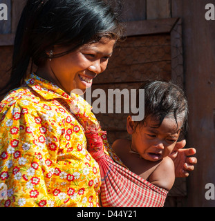 Cambodia mother with child in shawl Stock Photo