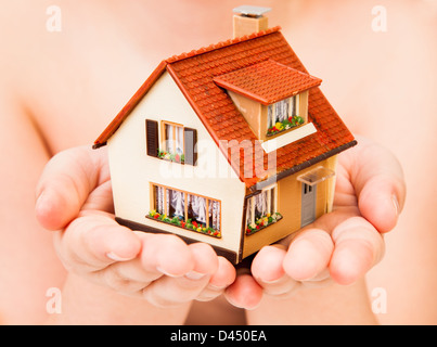 house in human hands Stock Photo