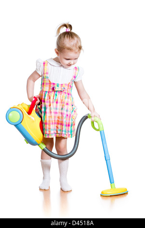 kid girl playing and cleaning room with toy vacuum cleaner Stock Photo