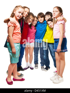 Group of happy 10 years old boys and girls standing together in semi-circle Stock Photo