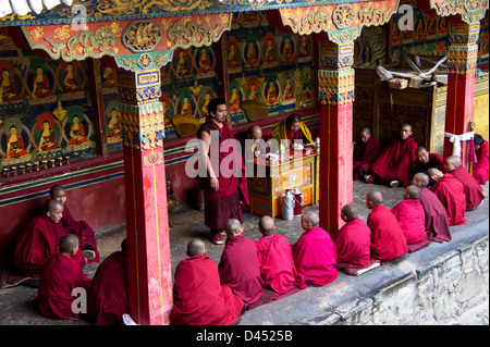 Young Buddhist monks in class with teacher Lamas, Tahsilhunpo monastery, Shigatse, Tibet Stock Photo