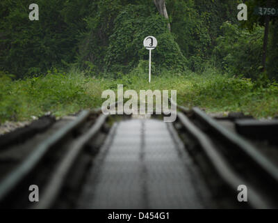 (dpa FILE) - An archive picture dated, 21 October 2011, shows a railtracks leading across a bridge which spans across the River Kwai in Kanchanaburi, Thailand. During World War Two the Japanese army transported thousands of prisoners of war to Kanchanaburi and forced them to build a 415 kilometre long stretch of railway connecting Thailand and Birma. Most prisoners of war were from Australia, The Netherlands and England working under inhumane conditions. Photo: Soeren Stache Stock Photo