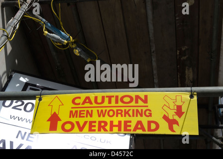 caution men working overhead sign in putney, southwest london, england Stock Photo