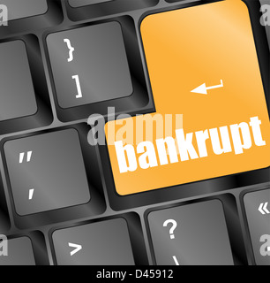 A keyboard with a yellow key reading bankrupt Stock Photo