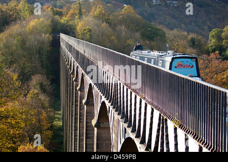 Pontcysyllte Aqueduct in autumn with man crossing on boat Llangollen / Shropshire Union Canal Wrexham County North East Wales UK Stock Photo