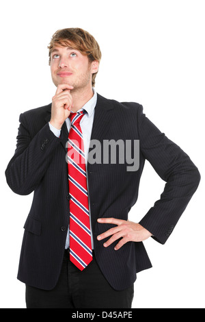 Young Caucasian business man looking up and contemplating an idea isolated on white background Stock Photo