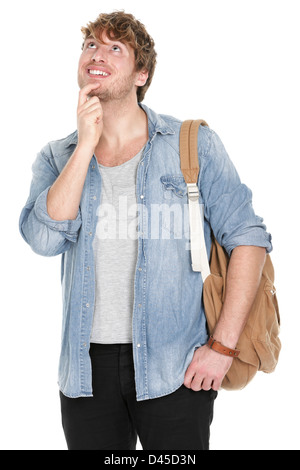 Handsome young man with backpack thinking while looking up isolated on white background Stock Photo