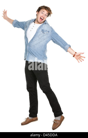 Full length of excited young man in his twenties jumping isolated on white background Stock Photo
