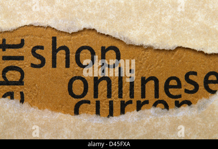 Shop online text on paper hole Stock Photo