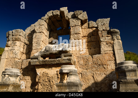 Remains of the Nymphaeum fountain with statue of river god Kestros at Perge archaeological site Turkey against blue sky Stock Photo