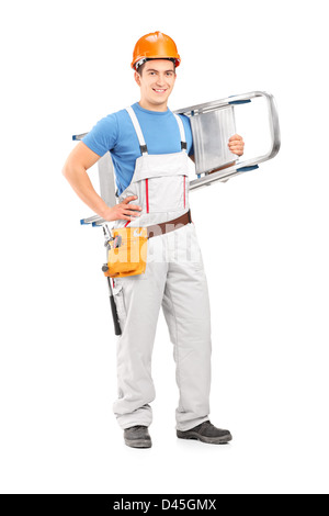 Full length portrait of a manual worker with a helmet carrying a ladder isolated against white background Stock Photo