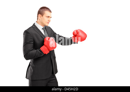 Man in suit with red boxing gloves Stock Photo