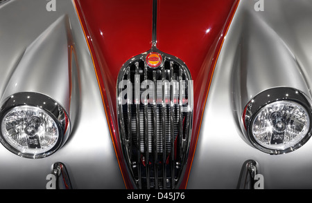 License available at MaximImages.com - 1955 Jaguar XK140 FHC custom classic vintage car front grill and headlights details closeup Stock Photo