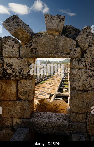 View of the main colonade and pool at Perge Turkey archaeological site from the north Nymphaeum with statue of Kestros Stock Photo