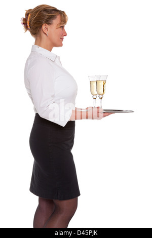 Profile of a waitress holding a silver tray with two glasses of Champagne, isolated on a white background. Stock Photo