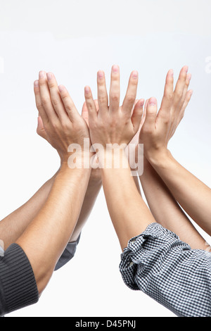 businessmen's hands gethered up together in the air as if holding something Stock Photo