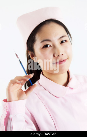 A young and pretty Asian nurse. Stock Photo