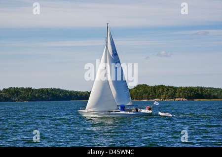 Finland, Turku Archipelago, sailing boat in the narrow between Stortervolande and Lillandet Stock Photo