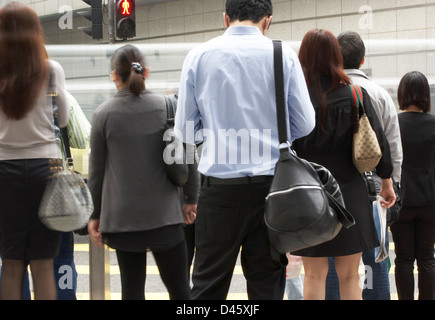 Commuters Crossing Busy Hong Kong Street Stock Photo