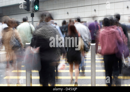 Commuters Crossing Busy Hong Kong Street Stock Photo