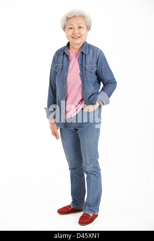 Full Length Studio Shot Of Chinese Senior Woman Stock Photo