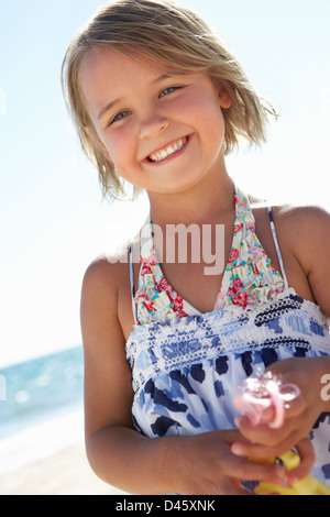 Young Girl Playing On Sunny Beach