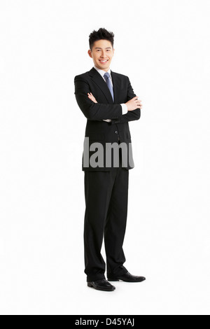 Full Length Studio Portrait Of Chinese Businessman Stock Photo