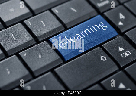 Concepts of E-learning, for computer based learning, with a message on enter key of keyboard. Stock Photo