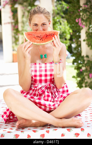 Woman Enjoying Slice Of Water Melon Stock Photo
