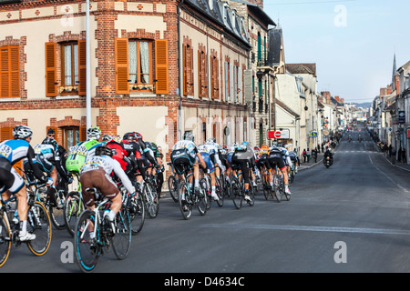 Image of the peloton riding during the first stage of the famous road bicycle race Paris-Nice, on March 4, 2013 in Nemours. Stock Photo