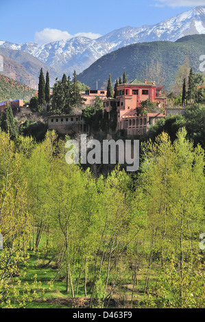 View of traditional Moroccan villages driving up the Ourika Valley towards Setti Fatma, with views of the snow covered High Atlas Mountains Morocco Stock Photo