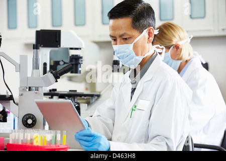 Male Scientist Using Tablet Computer In Laboratory Stock Photo
