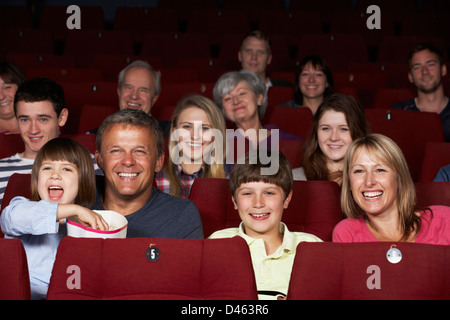 Family Watching Film In Cinema Stock Photo