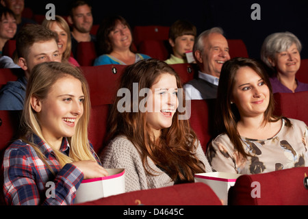 Group Of Teenage Girls Watching Film In Cinema Stock Photo