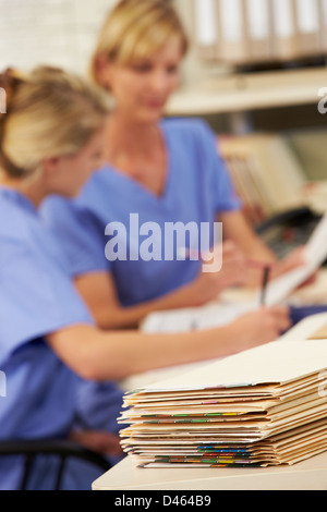 Patient Records On Desk At Nurses Station Stock Photo