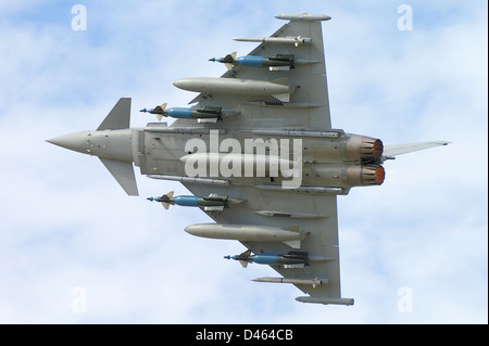 Eurofighter Typhoon plane with full weapons load displays its agility to aid with international sales of the jet fighter. Farnborough International Stock Photo