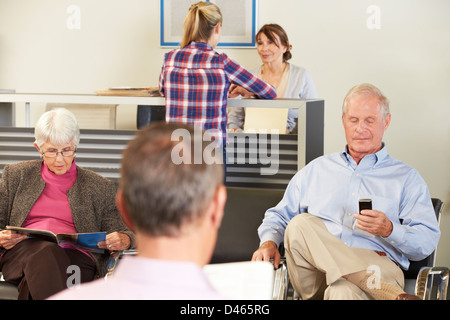 Patients In Doctor's Waiting Room Stock Photo