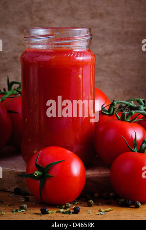 Traditional homemade tomato sauce and tomatoes Stock Photo