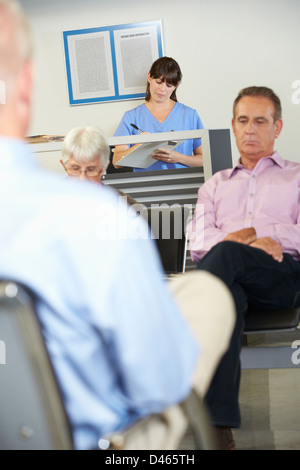 Patients In Doctor's Waiting Room Stock Photo