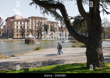 Park with fountain, and people walking, Fortezza da Basso, Florence Stock Photo