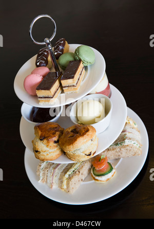 Afternoon tea with sandwiches and cakes Stock Photo