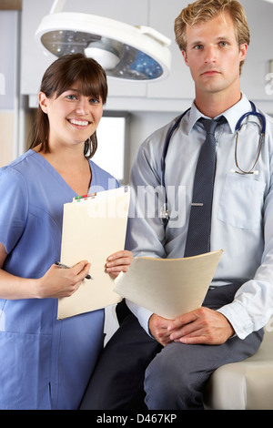 Portrait Of Doctor And Nurse In Doctor's Office