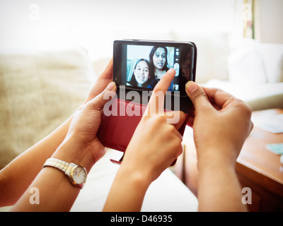 Mother and daughter self-portrait with smartphone