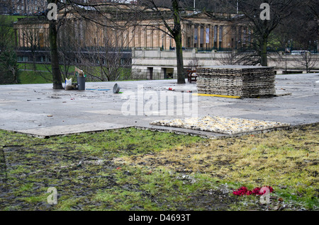 Damaged grass in Princes Street Gardens, Edinburgh, Scotland, after the removal of the Christmas Fair. Stock Photo