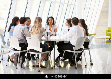 Business People Having Board Meeting In Modern Office Stock Photo