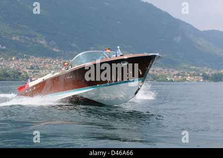 Riva Classic boat, Lake Como, Italy, July 2009. Classic Riva Ariston motorboat crossing Lake Como,in the Italian Lakes. Stock Photo