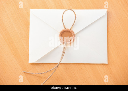 White envelope on wooden table. Stock Photo